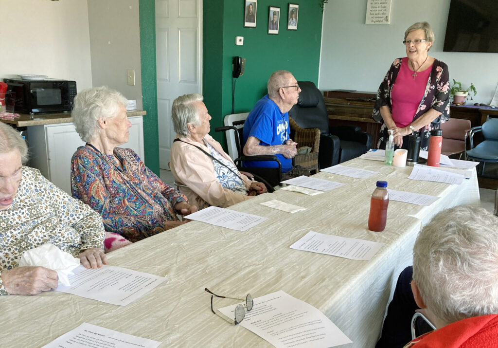 In the photo, Karen gives a heartfelt mini-sermon to a group at Park Place Assisted Living.